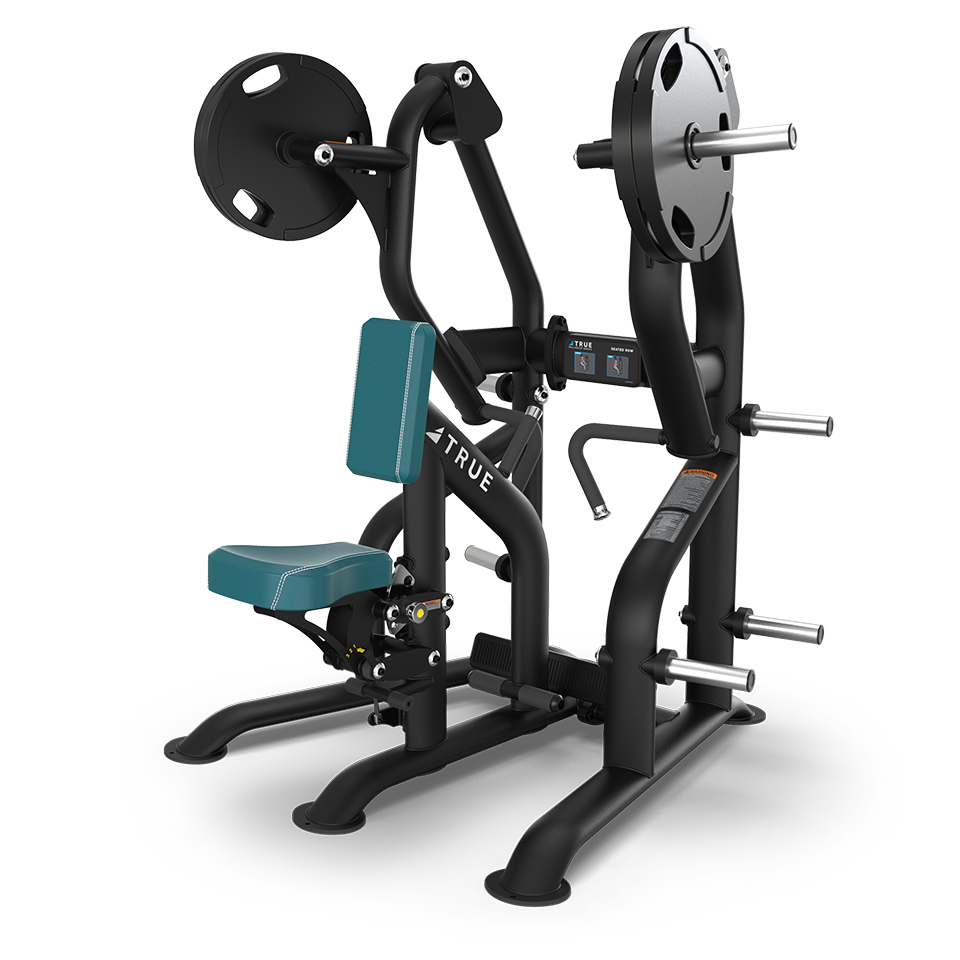 A plate-loaded chest press machine with teal seat and backrest. The machine features multiple handles, weight plates on each side, and several storage pegs for additional plates.