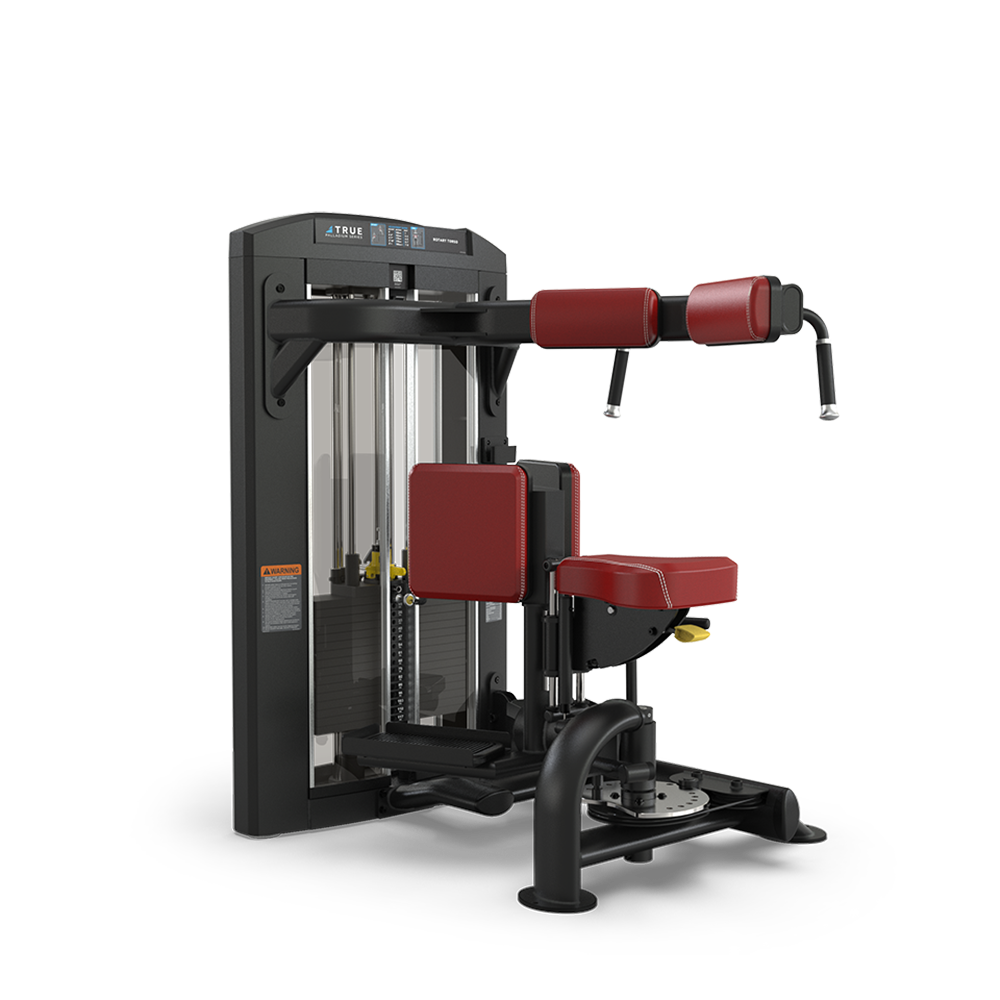 A commercial gym machine with a black frame and red padded seats and armrests, designed for performing torso rotation exercises, sits on a white background.