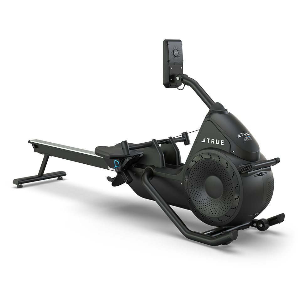 A sleek, black rowing machine with a padded seat, footrests, handlebars, and a digital display screen, set against a plain white background. The brand TRUE is visible on the side.