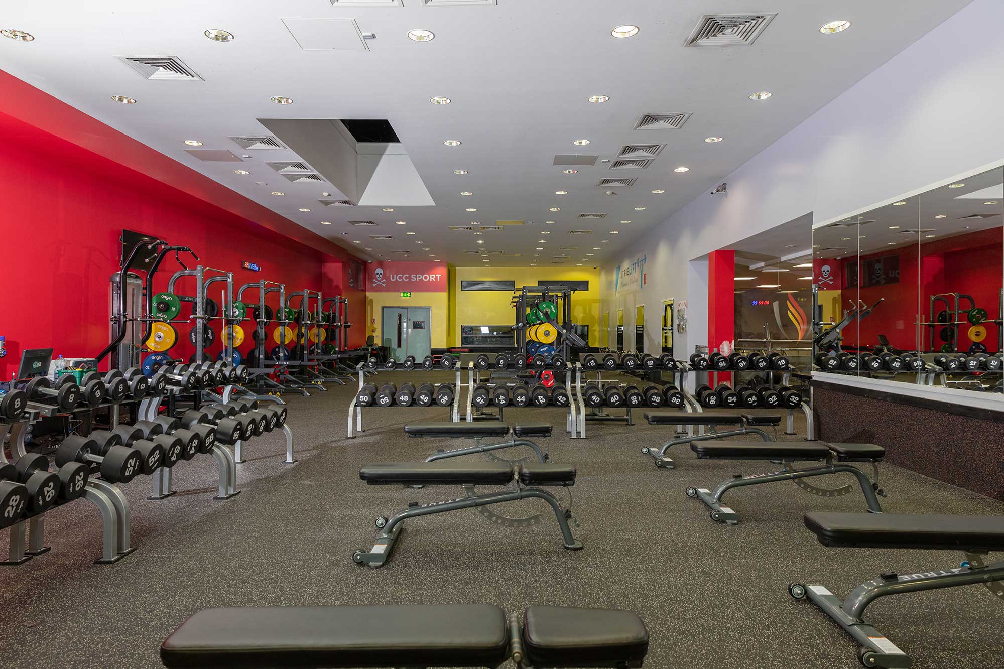 A large gym with several weights.