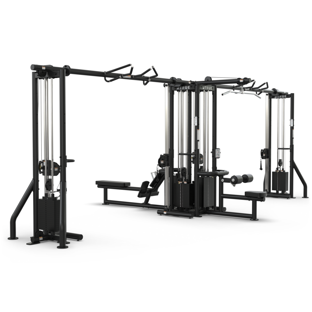 A large multifunctional gym machine with multiple stations, including cable pulleys, a bench, pull-up bars, and attachments for various strength training exercises, set against a plain white background.