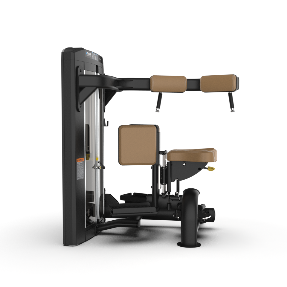 A commercial gym machine with padded brown seats and armrests, black frame, and weight stack, designed for seated abdominal or core exercises, set against a plain white background.