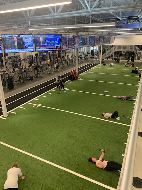 A group of people in a gym.