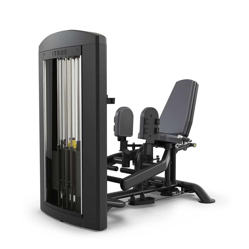 A commercial gym machine with a padded seat, backrest, and two adjustable foot platforms, used for leg exercises. The machine has a weight stack for adjustable resistance and a sturdy black frame.