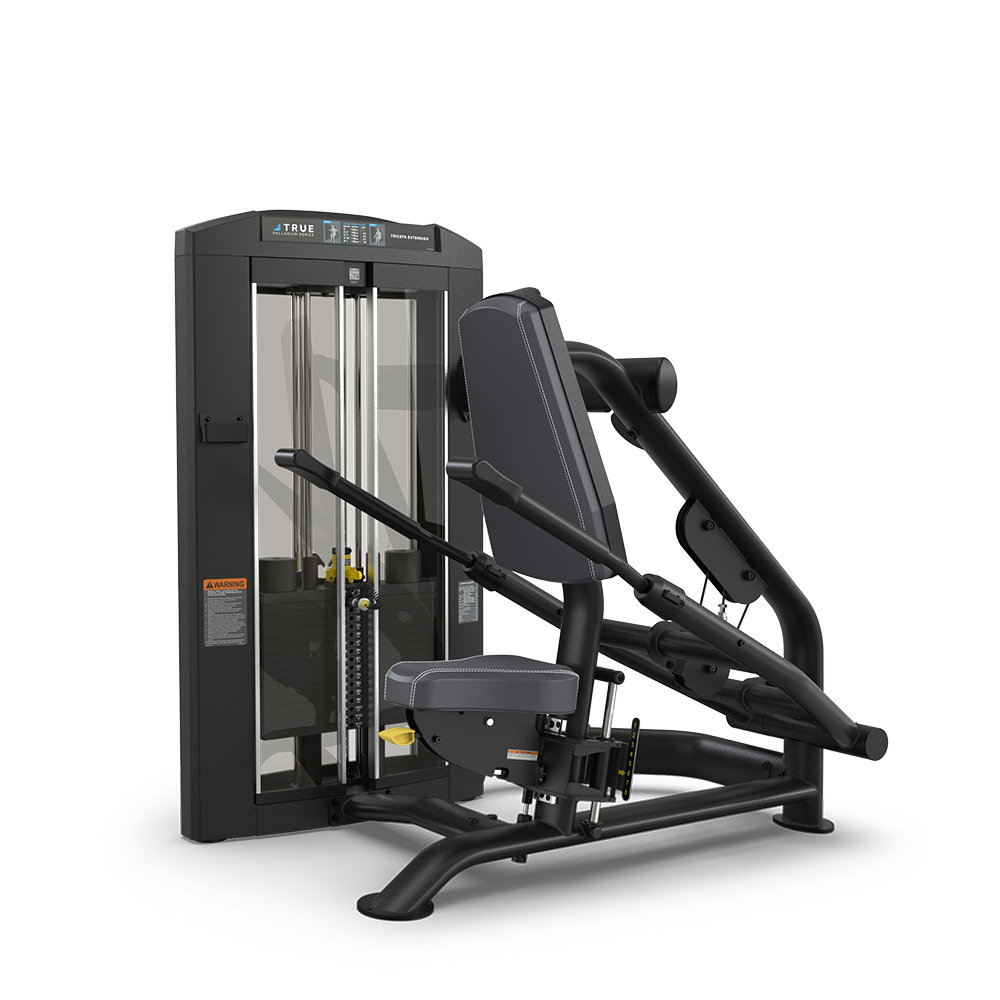 A black and gray seated chest press machine in a gym setting, featuring padded seat and backrest, adjustable handles, and a weight stack with a transparent cover.