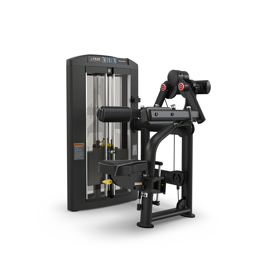 A black commercial gym machine with padded seats and armrests, adjustable weights, and instructional labels, designed for performing bicep curl exercises. The equipment is on a plain white background.