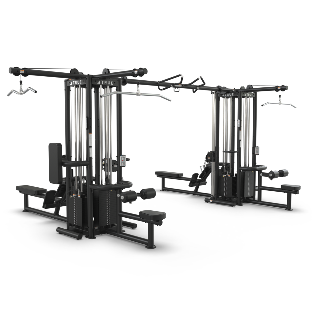 Two multi-station gym machines with pulleys, adjustable seats, handles, and bars for various strength training exercises, set against a plain white background.