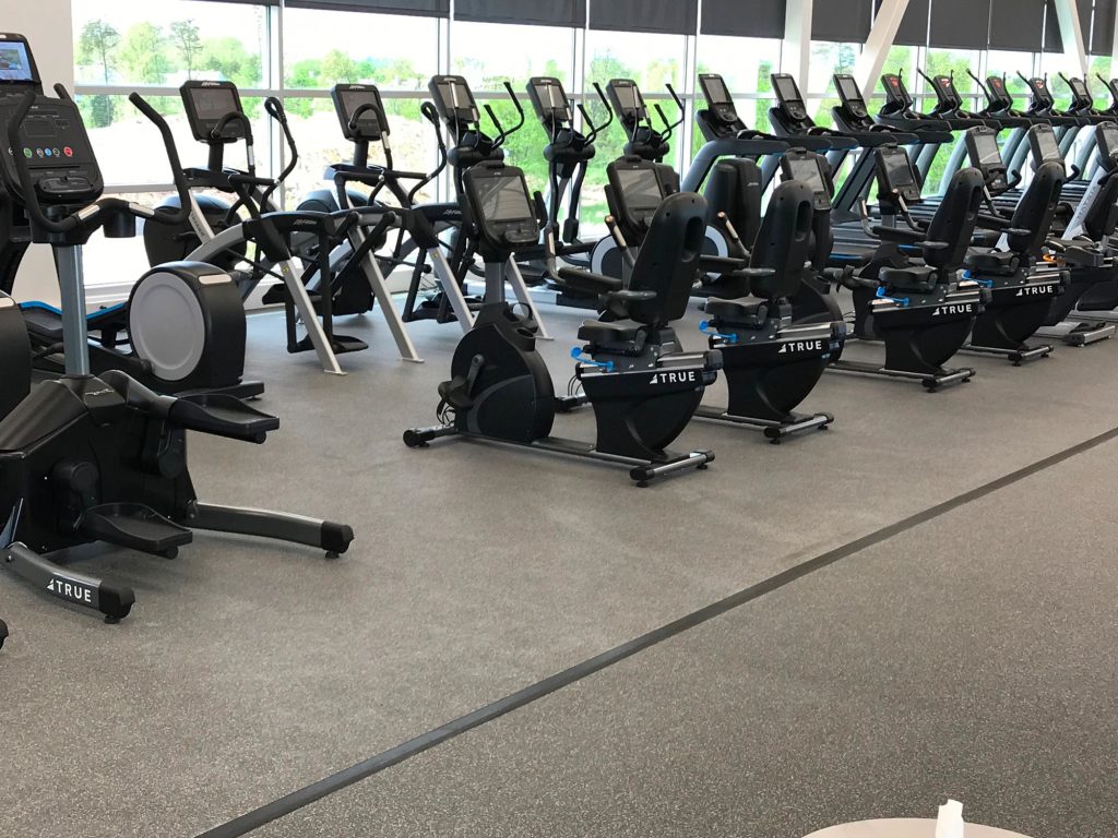 A large room with exercise bikes.