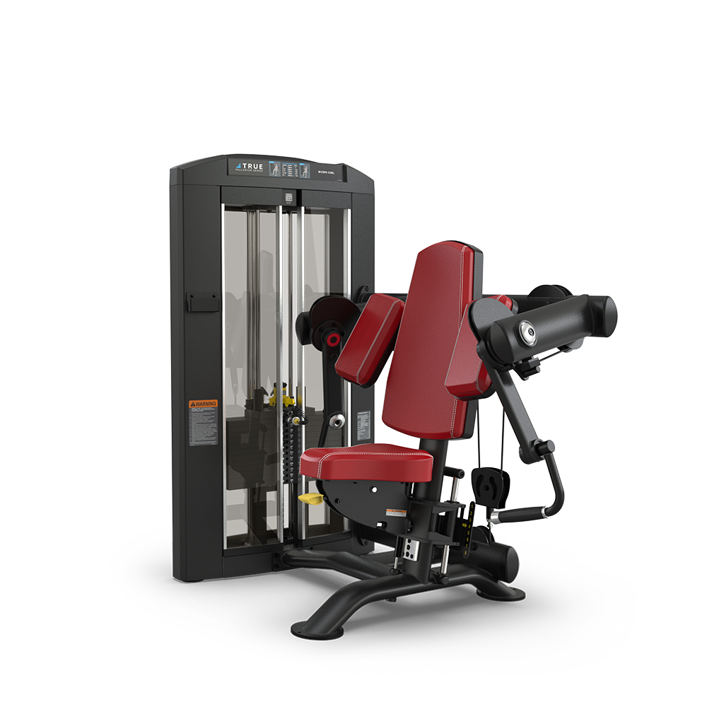 A red and black seated exercise machine with padded backrest and armrests, designed for strength training, placed against a plain white background. The machine features adjustable weights and a sturdy metal frame.
